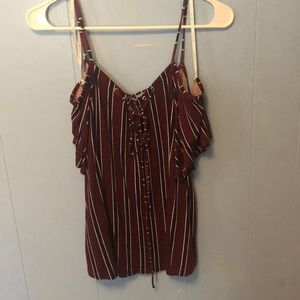A burgundy top with white and dark blue stripes